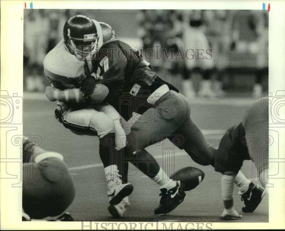 1990 Press Photo Jonesboto-Hodge football quarterback Eric Harrell loses ball- Historic Images