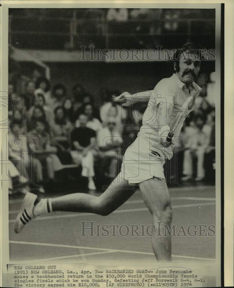 1974 Press Photo Tennis player John Newcombe makes backhand shot in New Orleans- Historic Images