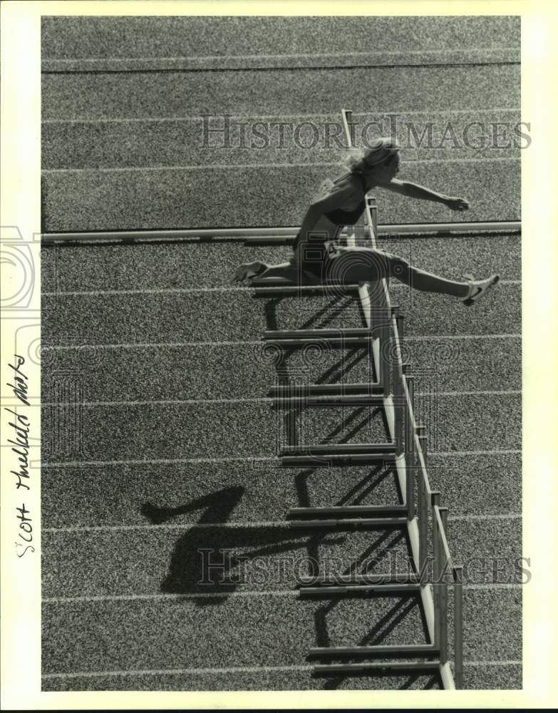 1993 Press Photo Woman leaps over hurdles during a track and field event - Historic Images