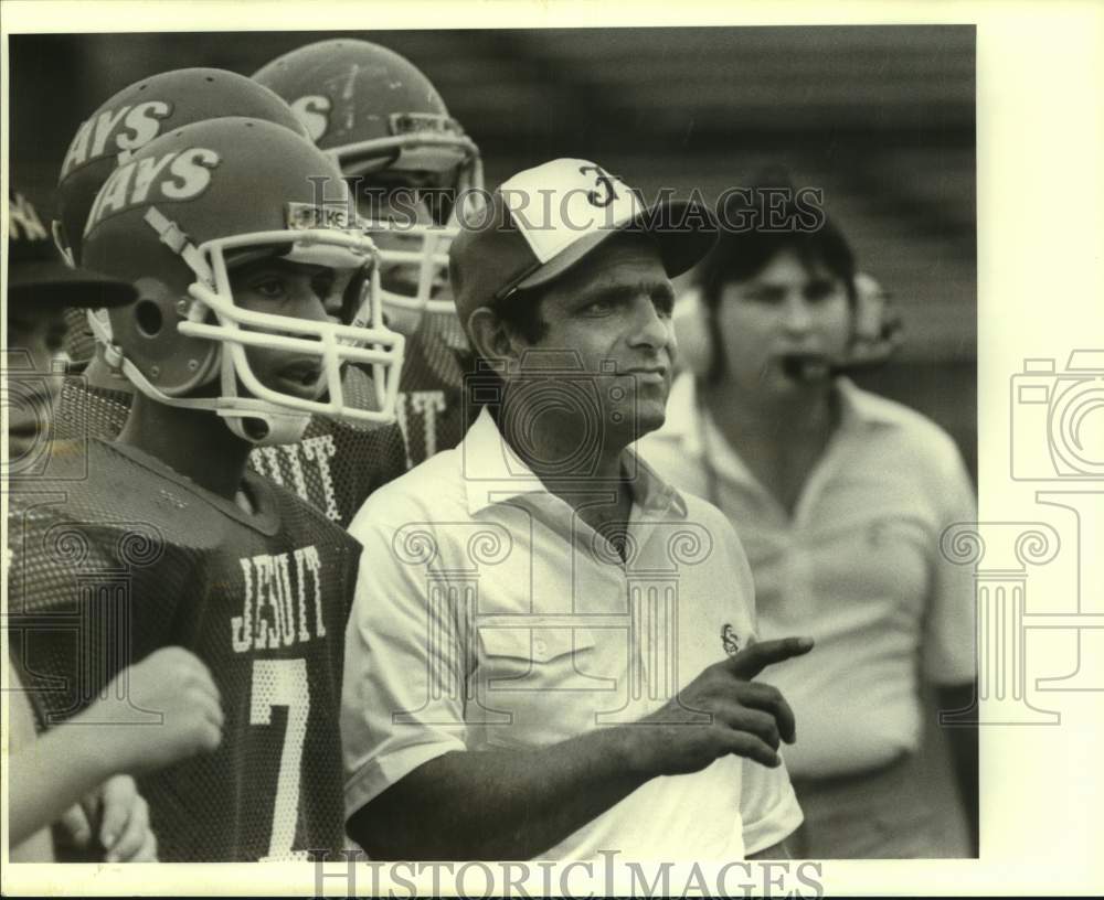 1988 Press Photo Jesuit football coach Frank Monica stands on sideline with team- Historic Images