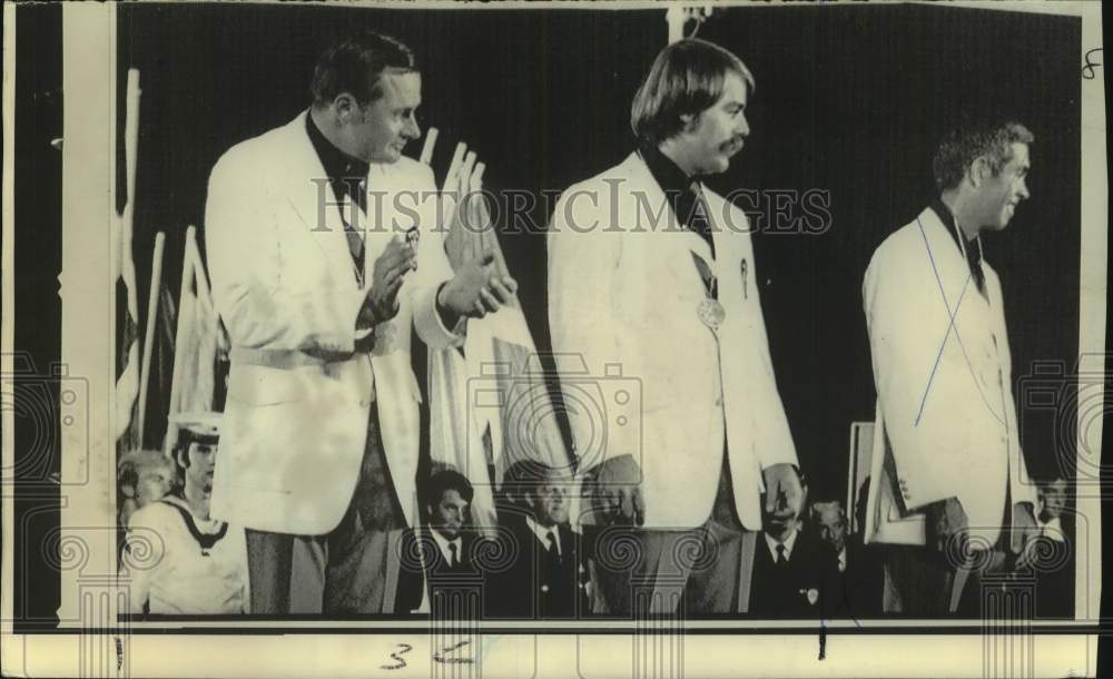 1972 Press Photo Three male Olympic sailing members stand on awards podium- Historic Images