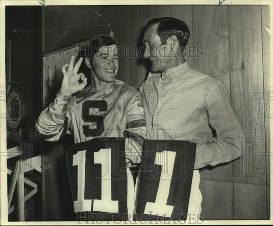 Press Photo Jockeys Tony Munster #11 and Jimmy Nichols #1 hold up racing numbers
