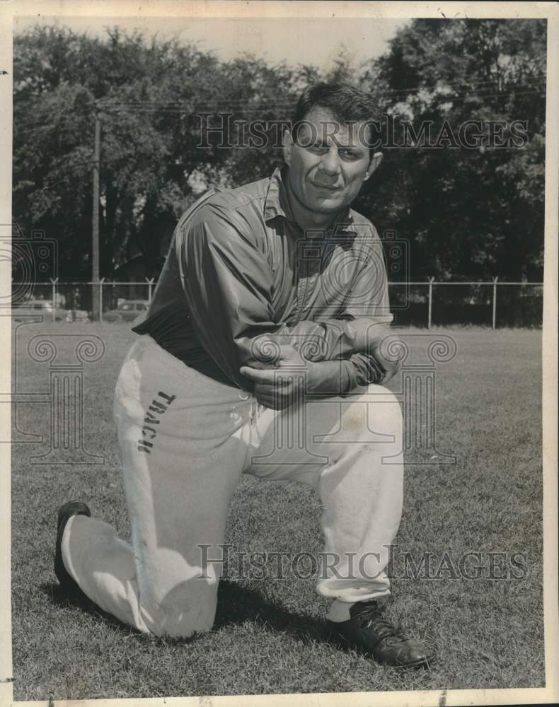 Press Photo Tulane football end coach Pete Pihos kneels down for photo- Historic Images