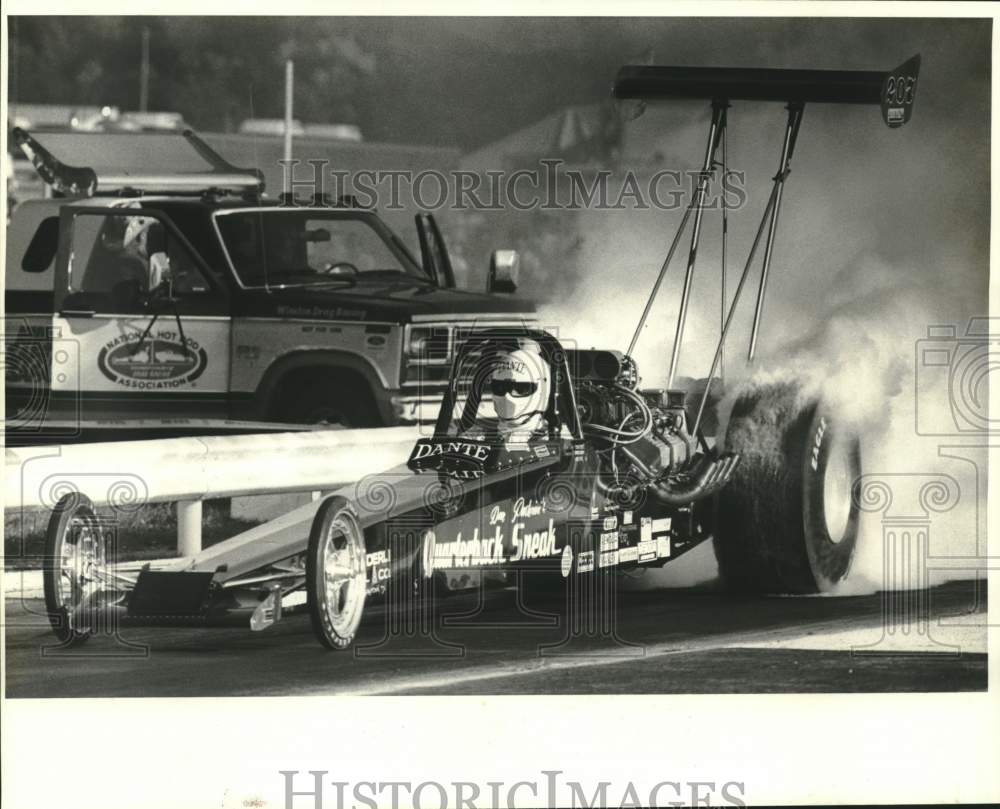 1985 Press Photo Drag racer Dan Pastorini smokes tires at Capitol starting line- Historic Images