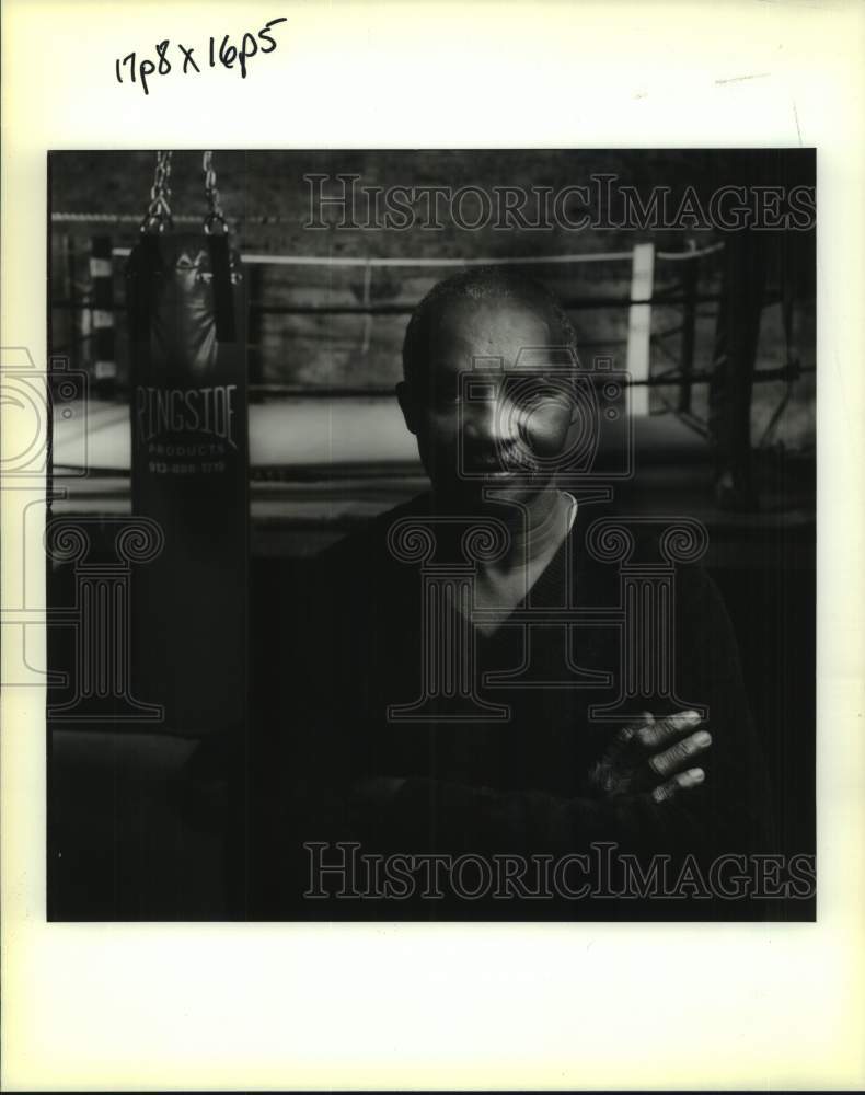 1993 Press Photo Boxer Percy Pugh stands outside boxing ring, with arms crossed- Historic Images