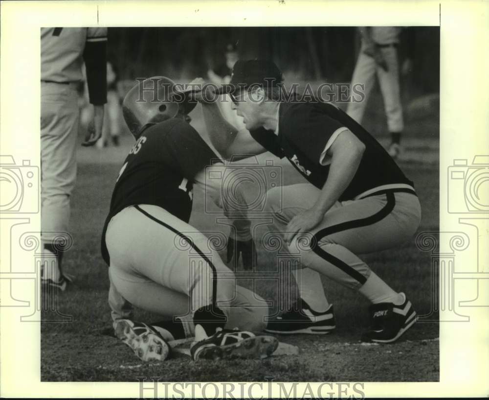 Press Photo East St John baseball coach Johnny Owen talks to player sliding- Historic Images