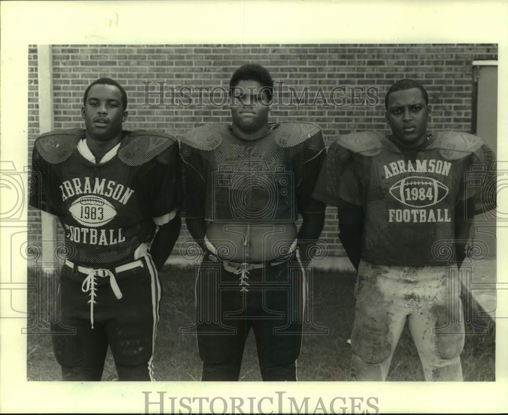 1986 Press Photo A trio of Abramson High School football players - nos30020- Historic Images