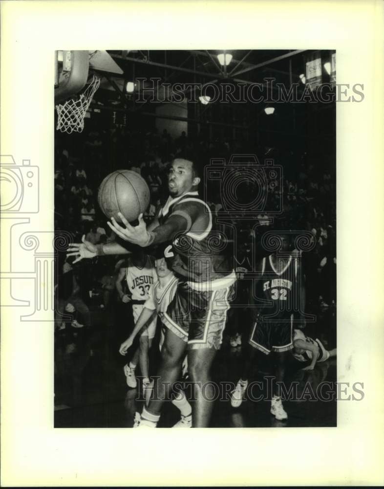 Press Photo St Augustine basketball player Maurice Robertson grabs rebound- Historic Images