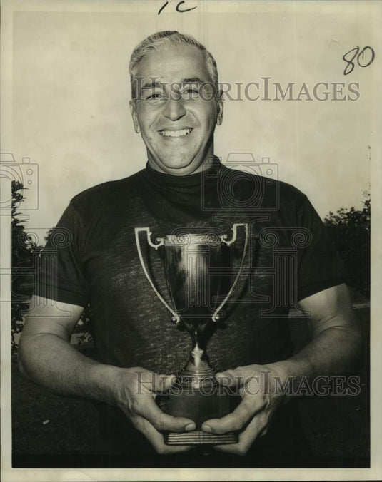 1967 Press Photo Golfer Bat Puissegur smiles and holds Shady Oaks GC trophy- Historic Images