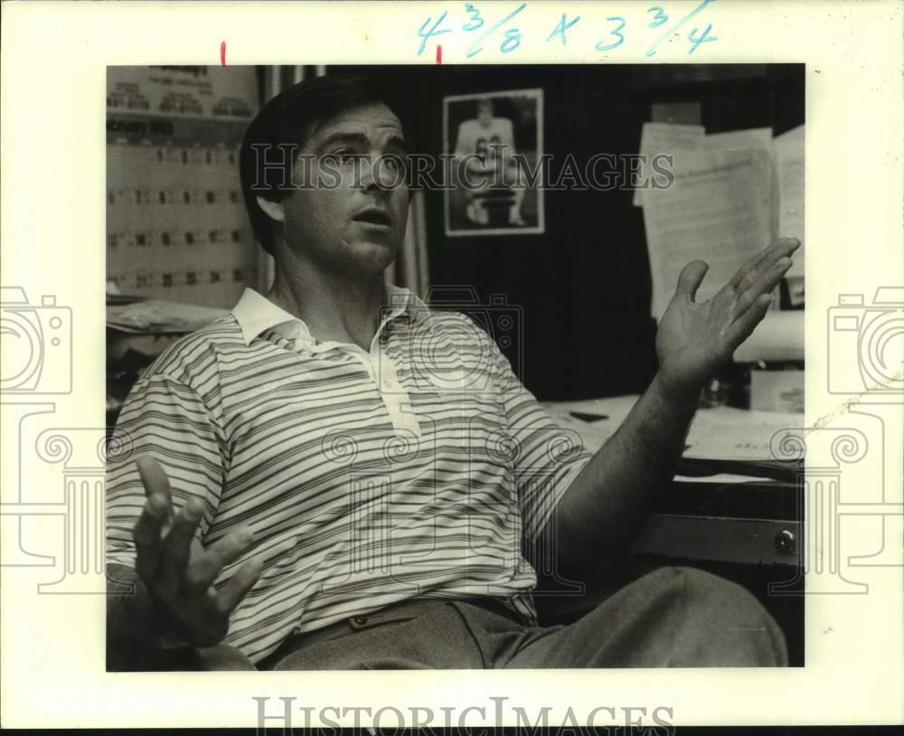 1983 Press Photo Rummel football coach George Ryan talks at his desk at school- Historic Images