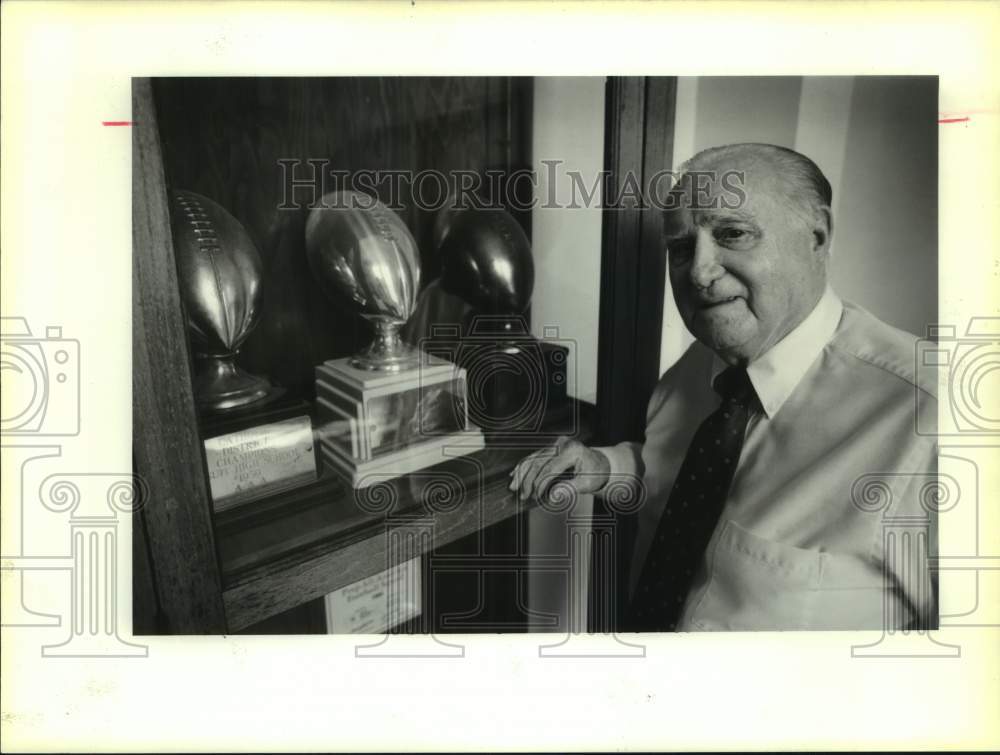 1991 Press Photo Jesuit HS athlete Ray Rizzo looks at football trophies- Historic Images