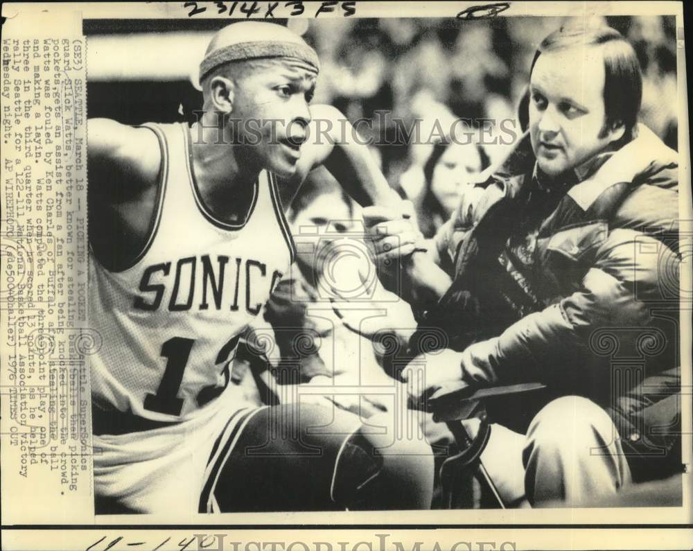 1976 Press Photo Seattle SuperSonics guard Slick Watts helped up by fan in crowd- Historic Images