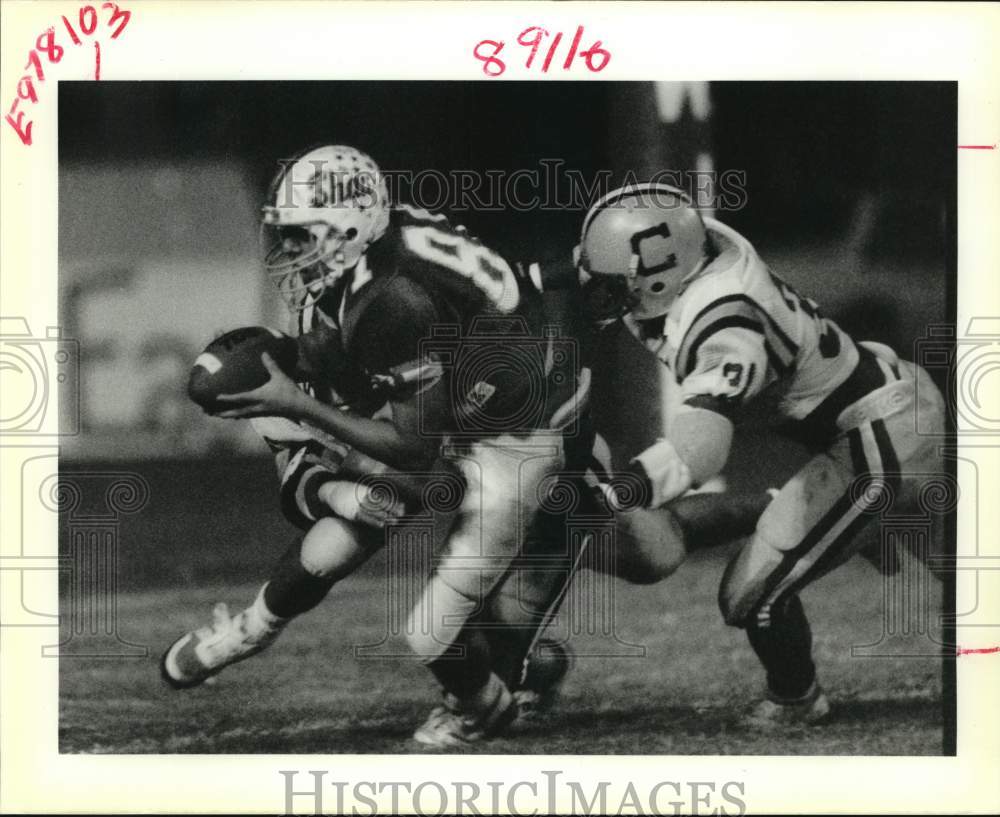 1988 Press Photo Shaw High School football player tackled by opposing players- Historic Images