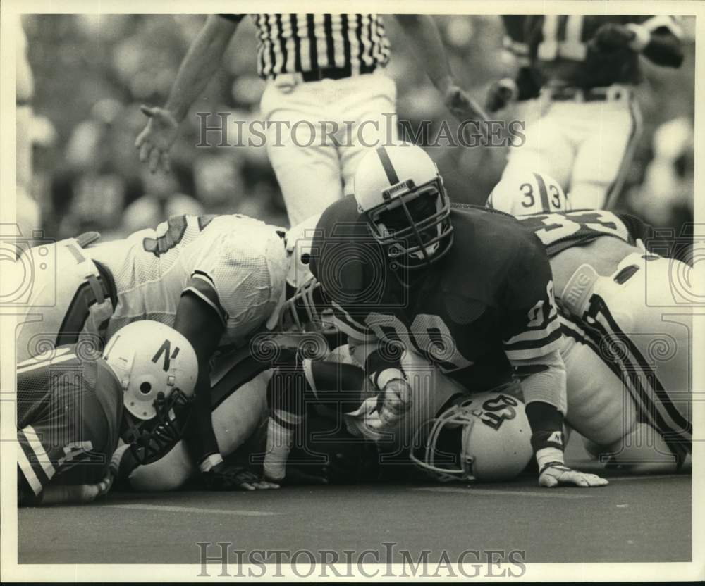 1985 Press Photo Ken Shead #99 crunches opponents. - nos35289- Historic Images