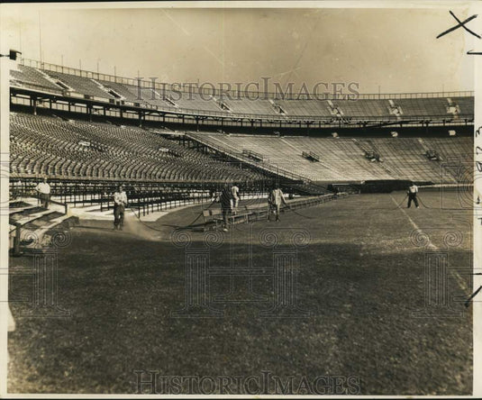1966 Press Photo Workmen Spray Turf Green at Tulane Football Stadium - nos36267- Historic Images