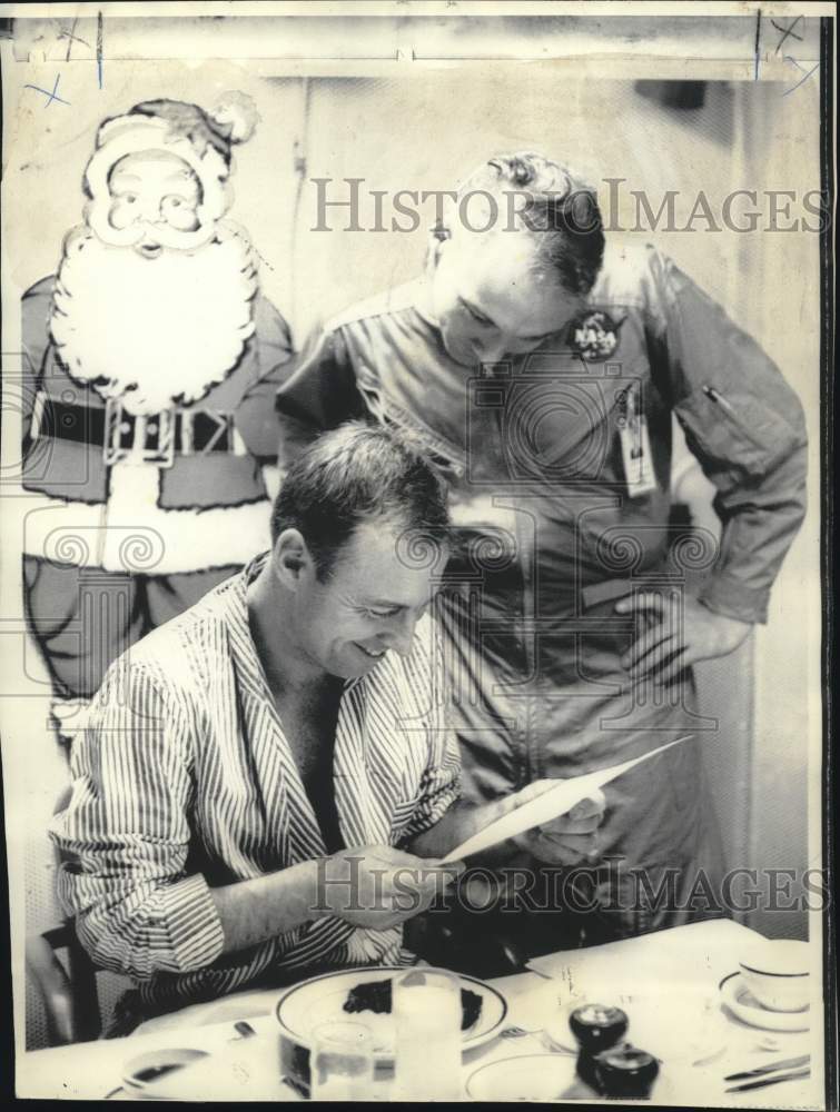 1968 Press Photo Apollo Astronaut James Lovell Reads Congratulations on Flight