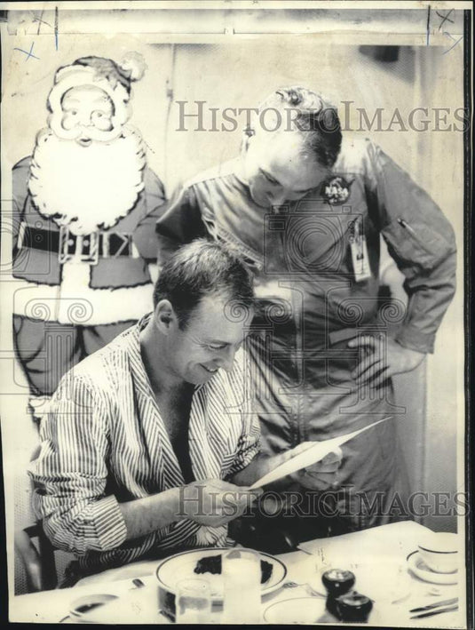 1968 Press Photo Apollo Astronaut James Lovell Reads Congratulations on Flight