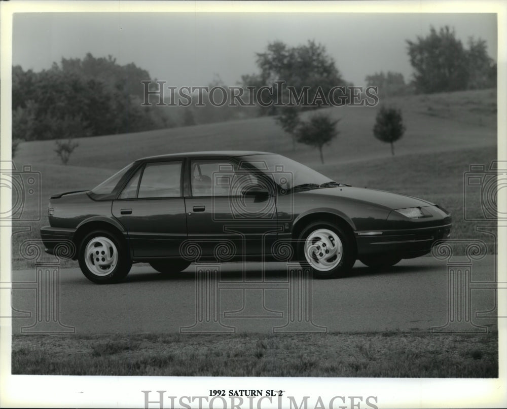 1992 Press Photo Saturn SL 2 Fourd Door Automobile Parked on Road- Historic Images