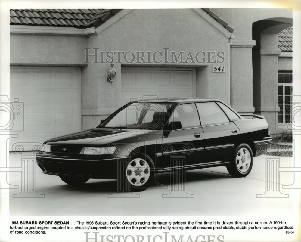 1993 Press Photo Subaru Sport Sedan Parked in Front of House- Historic Images