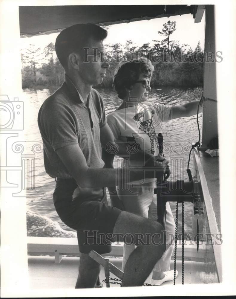 Load image into Gallery viewer, 1961 Press Photo Capt. Van Horn, his wife, Jean, on their boat in Lacombe bayou
