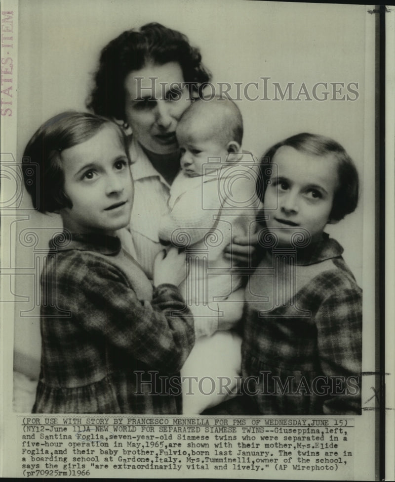 Load image into Gallery viewer, 1966 Press Photo Foglia Siamese twins with their mother and brother, Fulvio.
