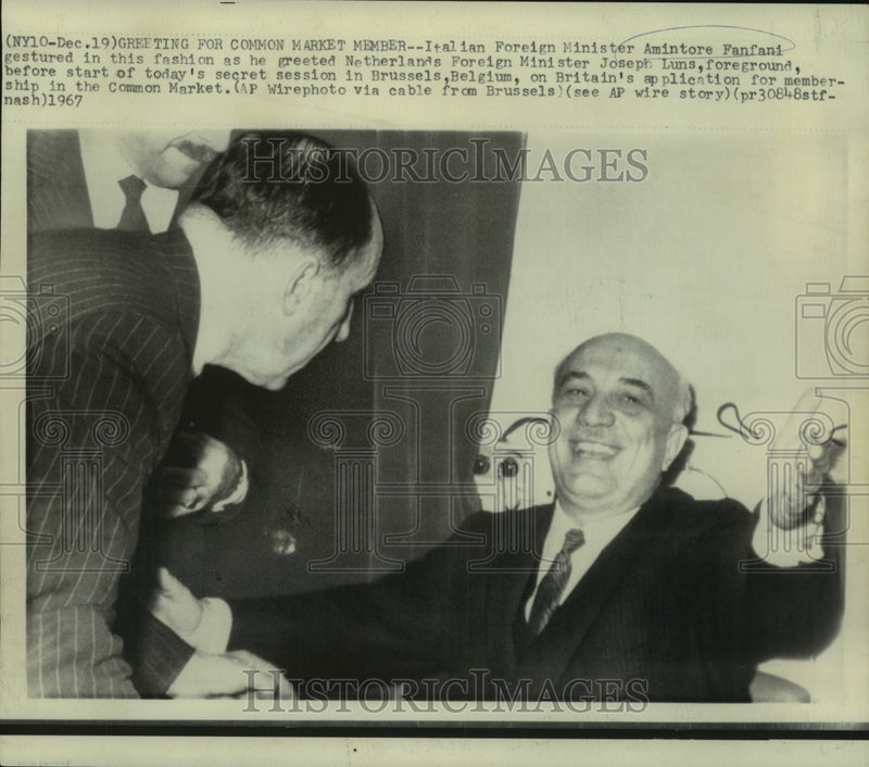 Load image into Gallery viewer, 1967 Press Photo Italy's Fanfani gestures as he greets Netherland's Joseph Luns
