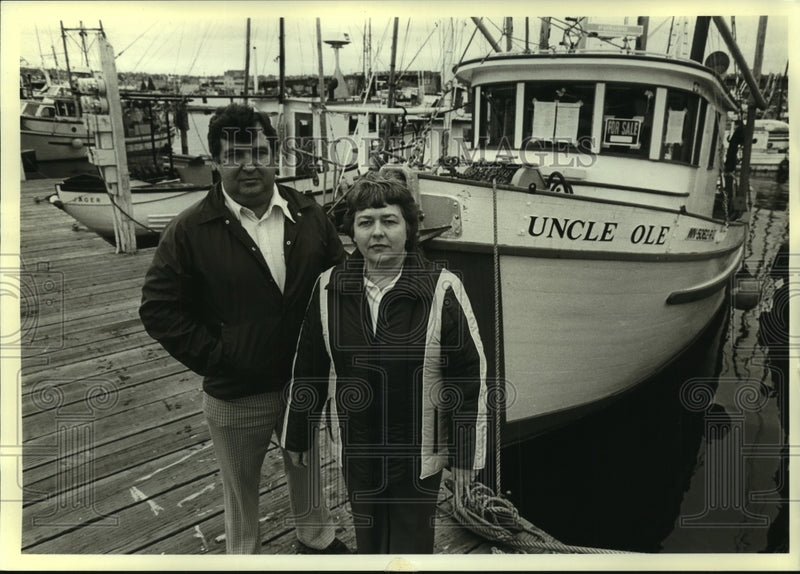Load image into Gallery viewer, 1981 Press Photo John &amp; Clara Fenton, commercial fishermen, have boat for sale.
