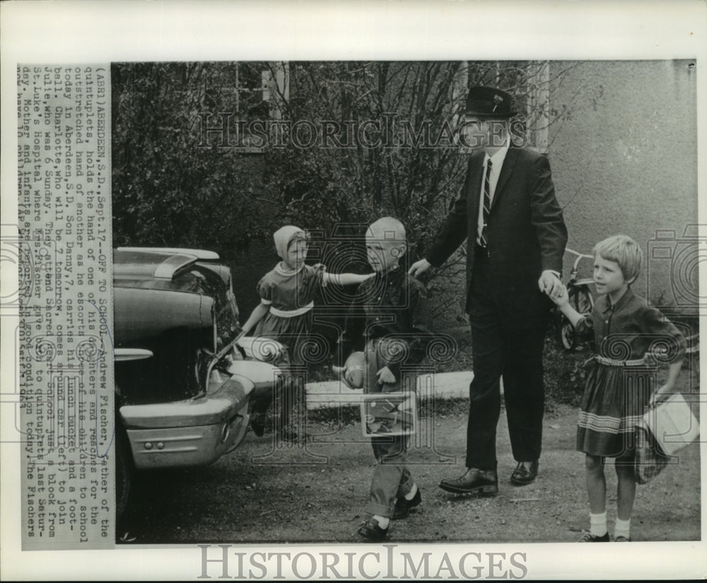 1963 Press Photo Andrew Fischer escorts his three of his children to school