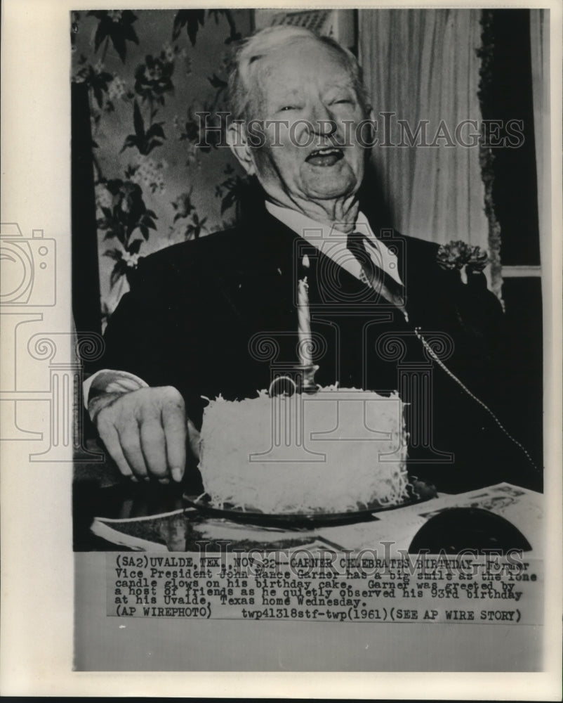 1961 Press Photo Former Vice-President Garner laughs at cake candle on birthday