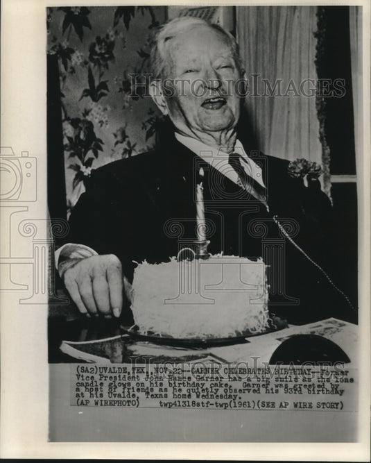 1961 Press Photo Former Vice-President Garner laughs at cake candle on birthday
