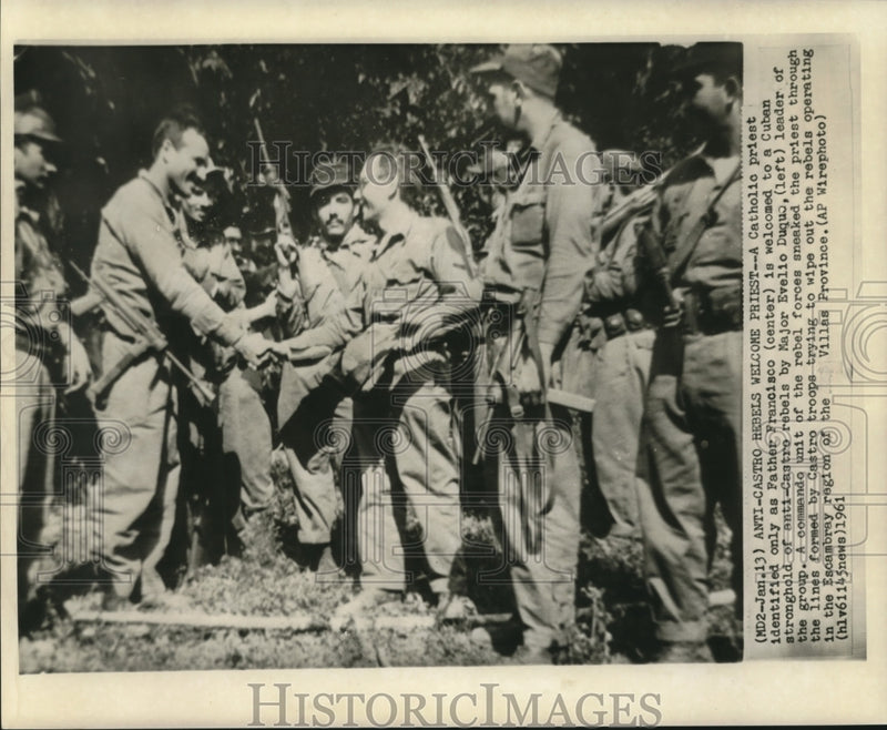 Load image into Gallery viewer, 1961 Press Photo Catholic priest Father Francisco welcomed by anti-Castro rebels
