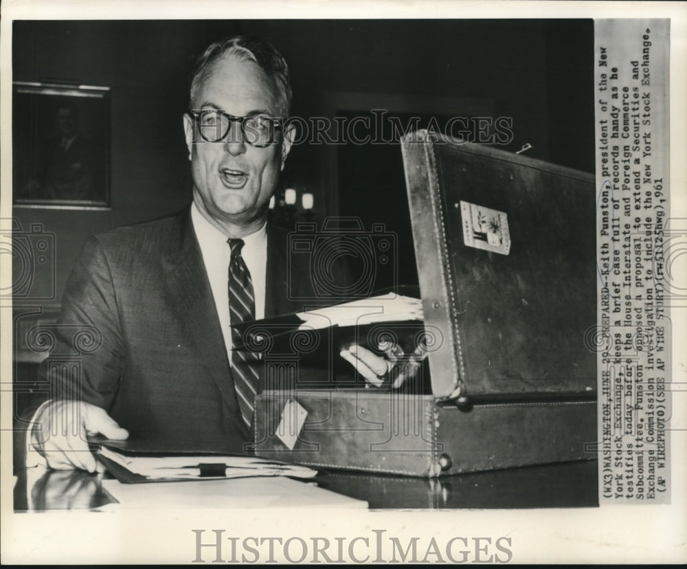 1961 Press Photo Keith Funston, Stock Exchange President, prepared with records