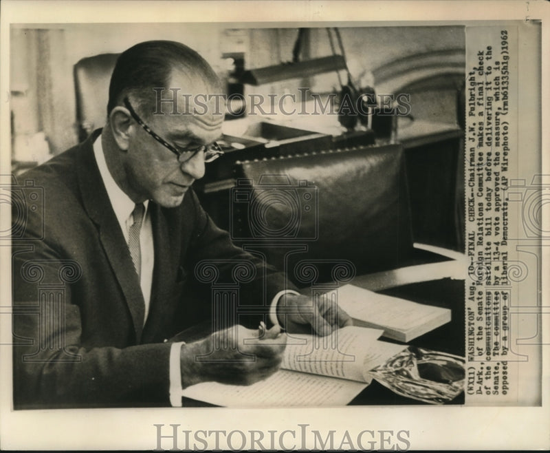 Load image into Gallery viewer, 1962 Press Photo Chariman Fulbright checks communication satellite bill
