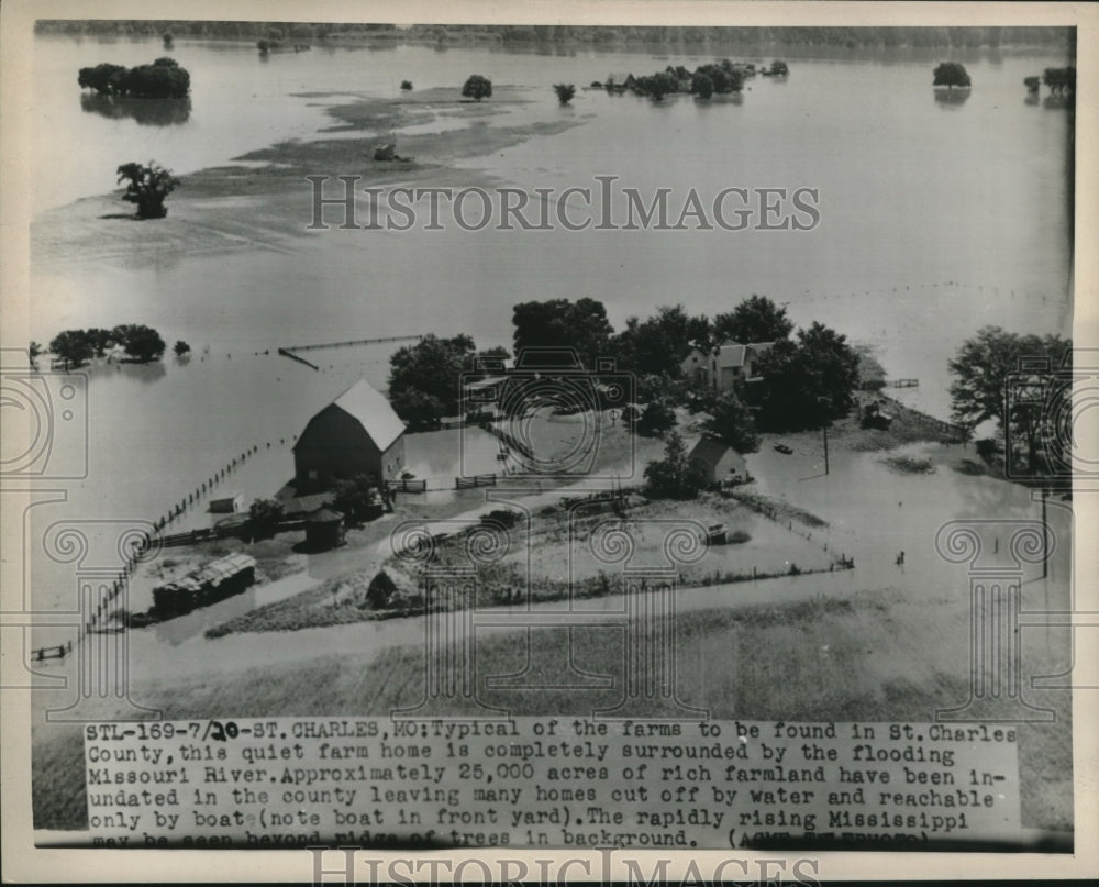 1951 Press Photo Farmhouse in St. Charles County surrounded by flooded river