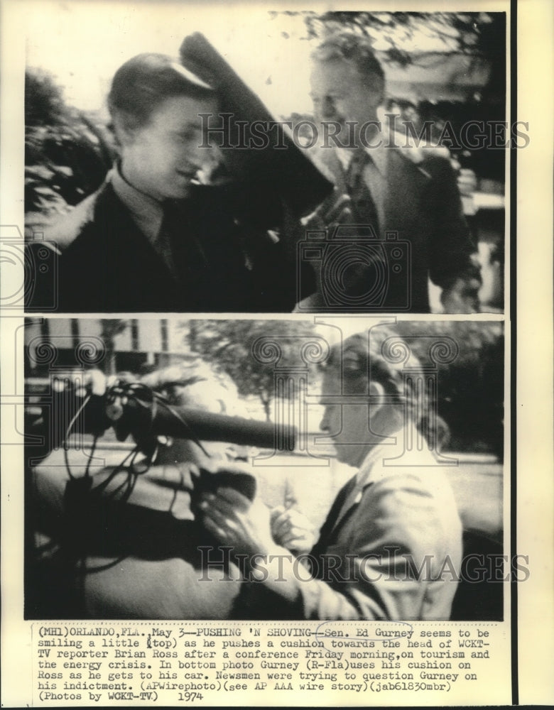 Load image into Gallery viewer, 1974 Press Photo Senator Ed Gurney and reporter Ross push and shove a cushion

