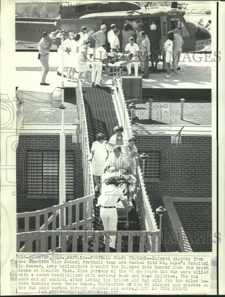 Load image into Gallery viewer, 1971 Press Photo Injured Gunnison players rushed to St. Luke's Hospital, Denver
