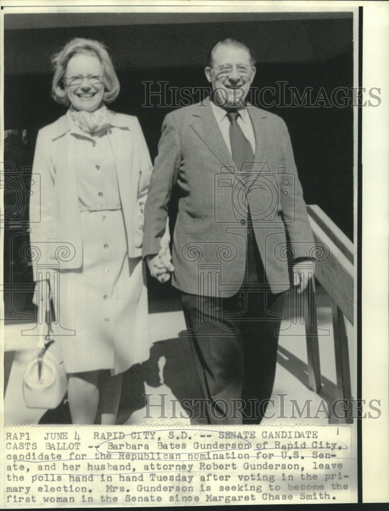 Load image into Gallery viewer, 1974 Press Photo Barbara Bates Gunderson &amp; husband, Robert, leaving the polls
