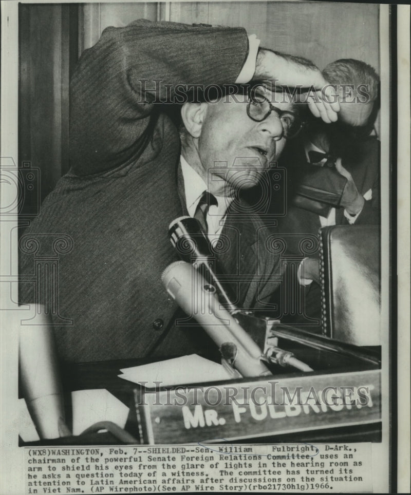 Load image into Gallery viewer, 1966 Press Photo Senator Fulbright shields eyes in Senate hearing room
