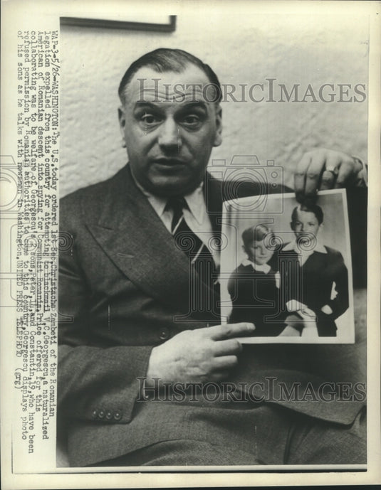 1953 Press Photo Blackmail victim V.C. Georgescu with photo of his two sons