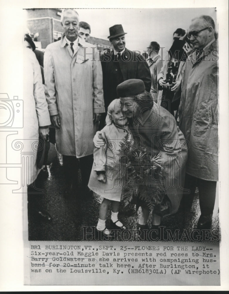 1964 Press Photo Maggie Davis presents red roses to Mrs. Barry Goldwater