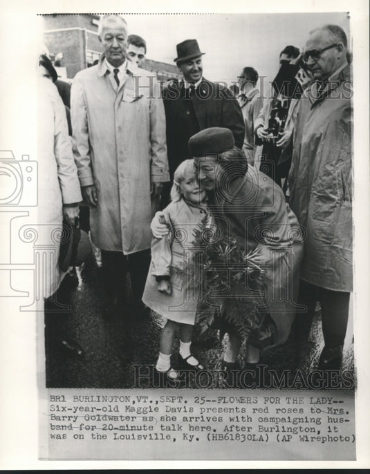 1964 Press Photo Maggie Davis presents red roses to Mrs. Barry Goldwater