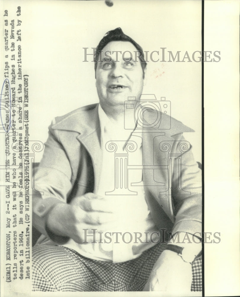 1976 Press Photo James Guiltner flips a quarter as he talks to newsmen