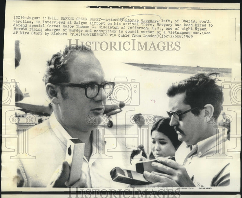 Load image into Gallery viewer, 1969 Press Photo Attorney George Gregory interviewed at Saigon airport
