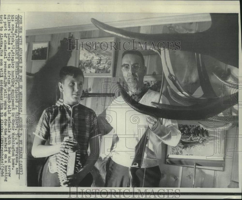 Load image into Gallery viewer, 1967 Press Photo Dr. Herbert Gilbert &amp; son Dick, display hunting equipment

