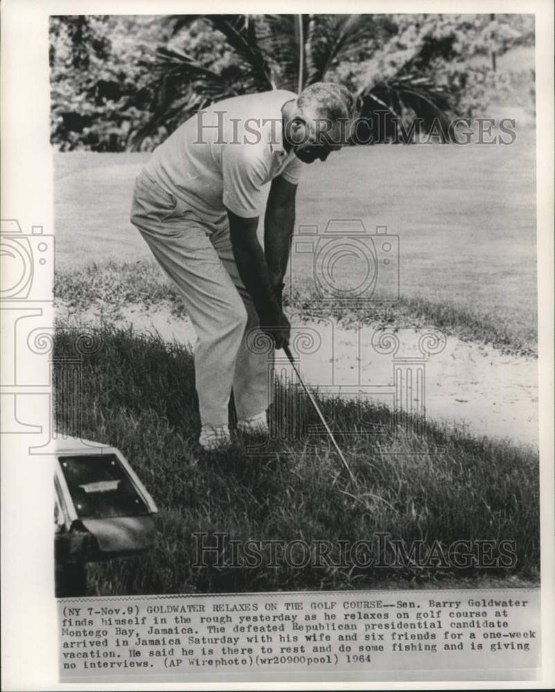 Load image into Gallery viewer, 1964 Press Photo Goldwater relaxes on Montego Bay, Jamaica golf course.
