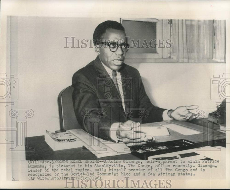 Load image into Gallery viewer, 1961 Press Photo Antoine Gizenga in his Stanleyville, The Congo, office
