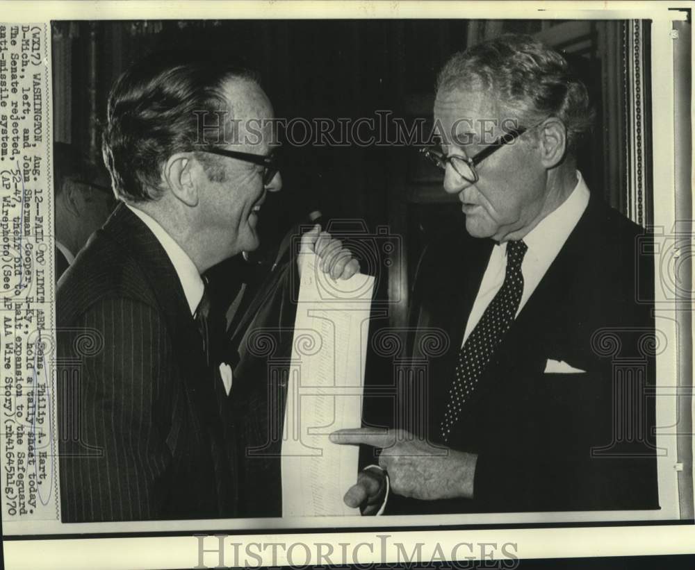 1970 Press Photo Senators Philip Hart &amp; Cooper hold Safeguard voting tally sheet