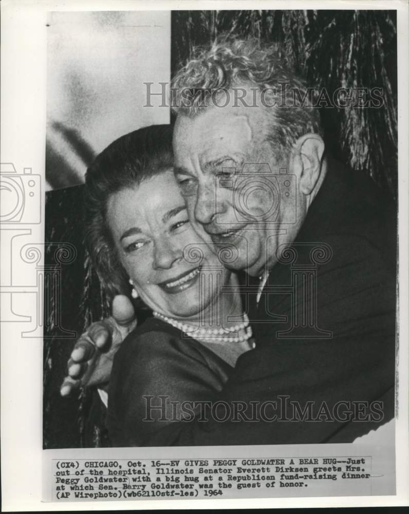 Load image into Gallery viewer, 1964 Press Photo Senator Everett Dirksen gives Peggy Goldwater a hug in Chicago

