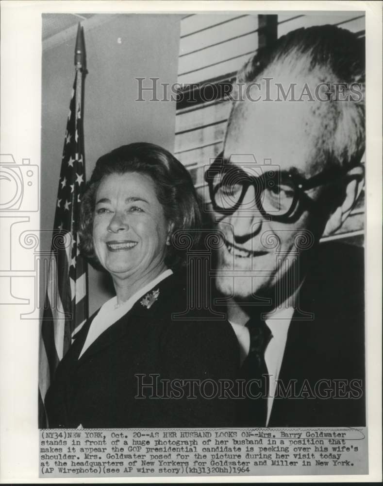 1964 Press Photo Mrs. Barry Goldwater in front of her husband's photograph in NY