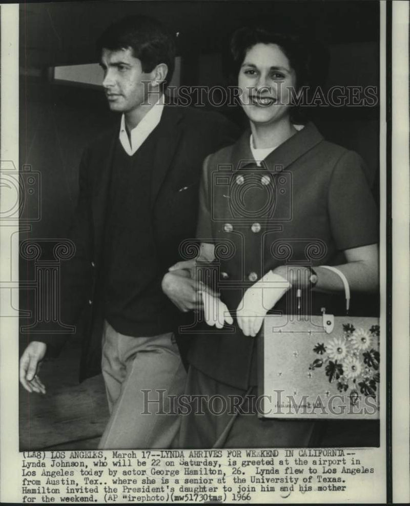 Load image into Gallery viewer, 1966 Press Photo Lynda Johnson greeted at Los Angeles airport by George Hamilton
